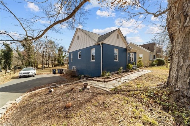 view of home's exterior with driveway