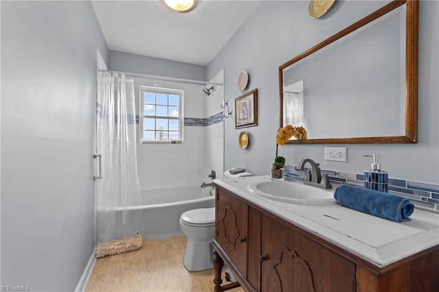 full bath with shower / tub combo, vanity, and toilet