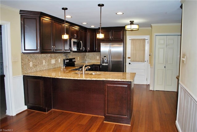 kitchen featuring kitchen peninsula, stainless steel appliances, light stone counters, dark hardwood / wood-style floors, and pendant lighting