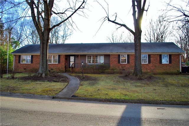 ranch-style home featuring a front yard