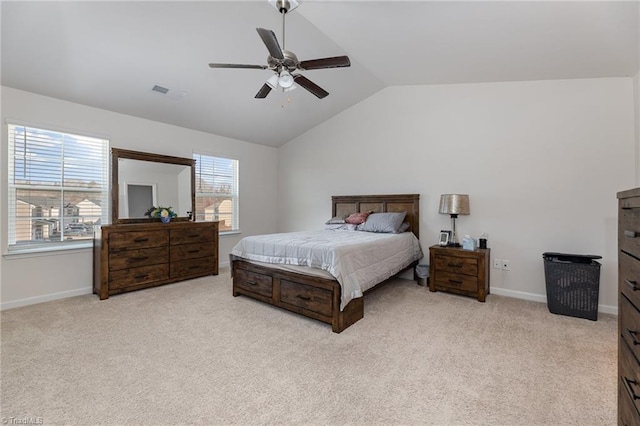 bedroom featuring vaulted ceiling, carpet flooring, baseboards, and ceiling fan