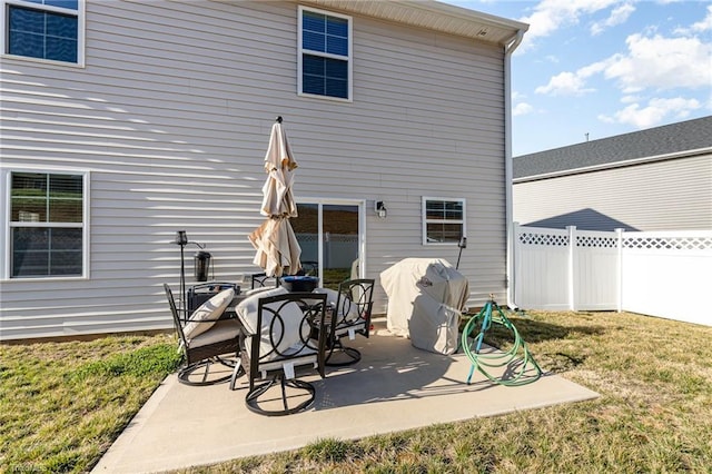 back of house with a patio area, a yard, and fence