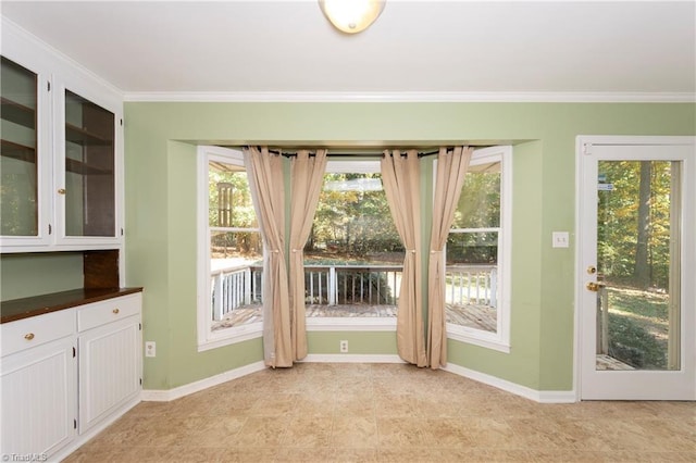 doorway to outside with crown molding