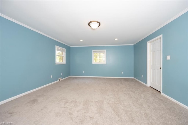 carpeted empty room featuring ornamental molding