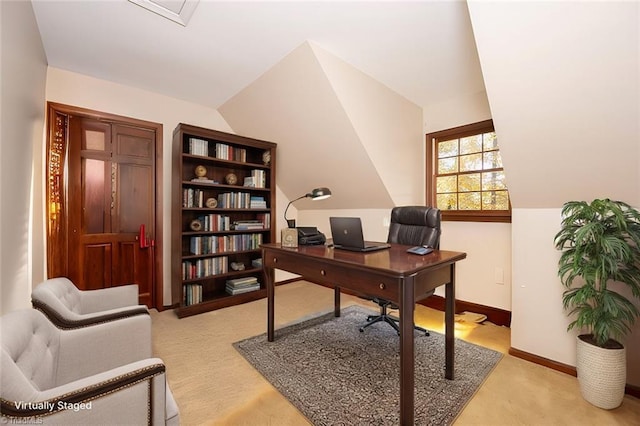 home office with lofted ceiling