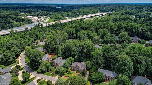 3612 Camden Falls Cir, Greensboro, NC 27410 - aerial overview of property's location featuring a heavily wooded area and nearby suburban area