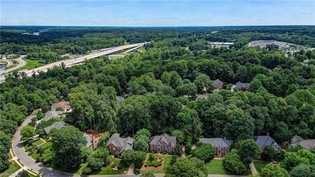 3612 Camden Falls Cir, Greensboro, NC 27410 - aerial perspective of suburban area featuring a heavily wooded area