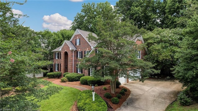 3612 Camden Falls Cir, Greensboro, NC 27410 - view of front of house featuring concrete driveway, a garage, and brick siding