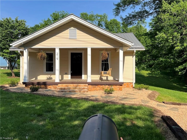 219 Highland Ave, Elkin, NC 28621 - bungalow with a front yard and a porch