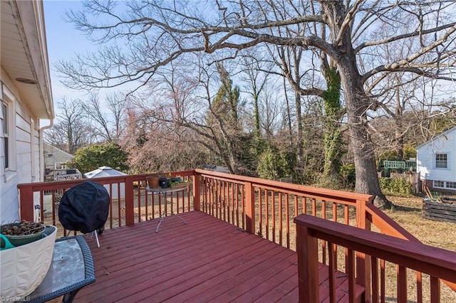 wooden terrace with area for grilling