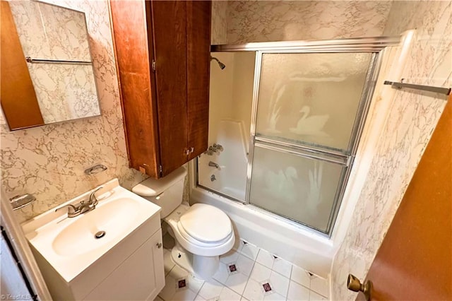 full bathroom with vanity, toilet, tile patterned floors, and enclosed tub / shower combo