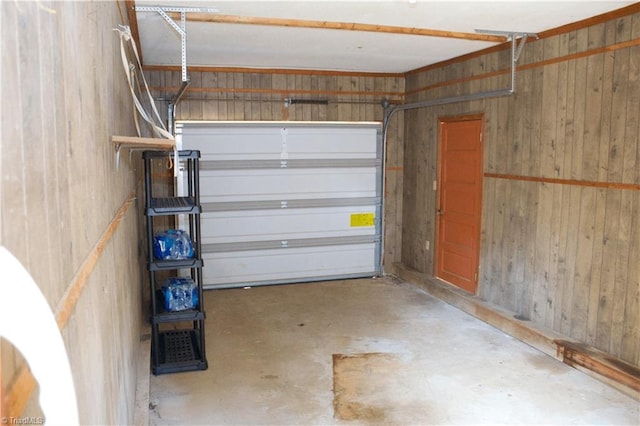 garage featuring wooden walls