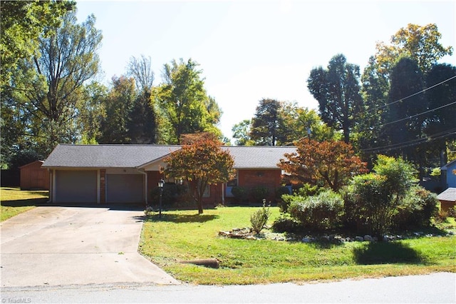 ranch-style home with a front yard and a garage