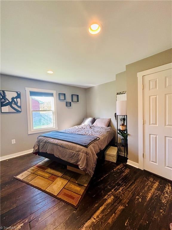 bedroom featuring dark wood-type flooring