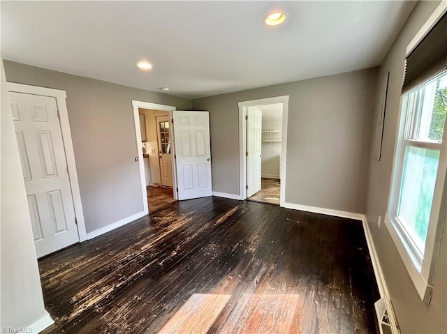 1699 W Pine St, Mount Airy, NC 27030 - unfurnished bedroom with hardwood / wood-style floors, baseboards, and recessed lighting