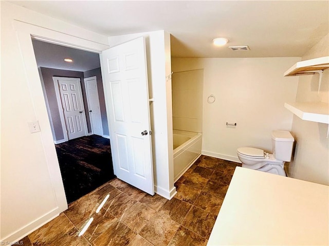 1699 W Pine St, Mount Airy, NC 27030 - bathroom with toilet, baseboards, and bathing tub / shower combination