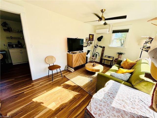 living room with a wall mounted AC, ceiling fan, and dark hardwood / wood-style flooring