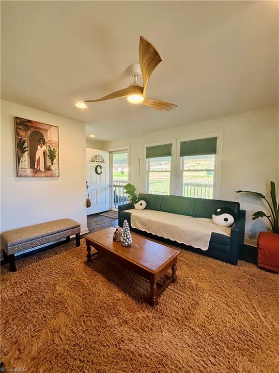 living room featuring ceiling fan