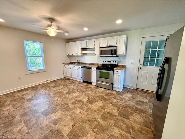 1699 W Pine St, Mount Airy, NC 27030 - kitchen featuring stainless steel appliances, white cabinetry, baseboards, and recessed lighting