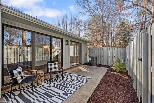 view of patio / terrace featuring a fenced backyard and central AC