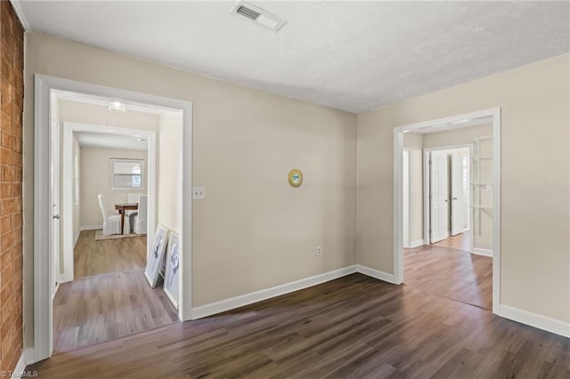 5054 Meadowbrook Dr, Trinity, NC 27370 - unfurnished room featuring dark wood-style floors and a textured ceiling