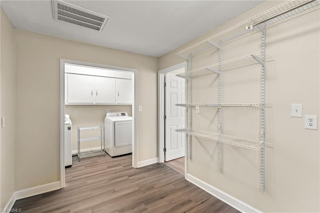 5054 Meadowbrook Dr, Trinity, NC 27370 - washroom with washer and dryer and wood finished floors