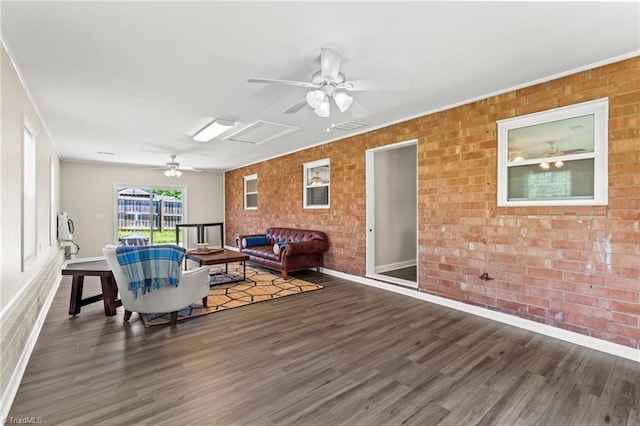 5054 Meadowbrook Dr, Trinity, NC 27370 - living room featuring a ceiling fan, wood finished floors, brick wall, and crown molding