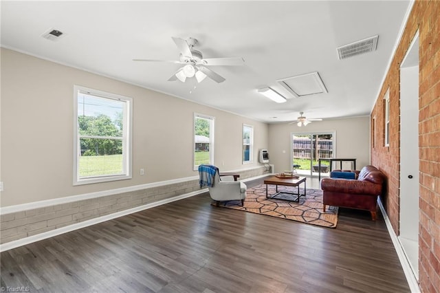 5054 Meadowbrook Dr, Trinity, NC 27370 - living room featuring a ceiling fan, wood finished floors, healthy amount of natural light, and brick wall