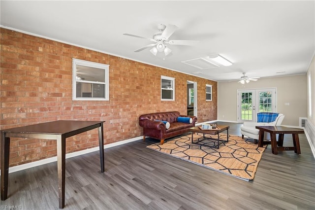 5054 Meadowbrook Dr, Trinity, NC 27370 - living room with wood finished floors, ceiling fan, and brick wall