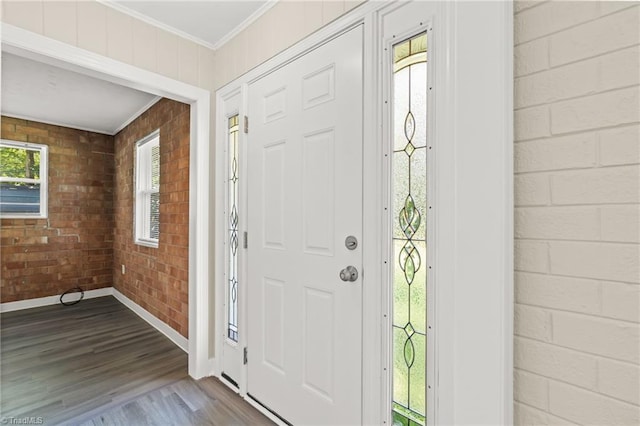 5054 Meadowbrook Dr, Trinity, NC 27370 - entryway with wood finished floors, ornamental molding, and brick wall