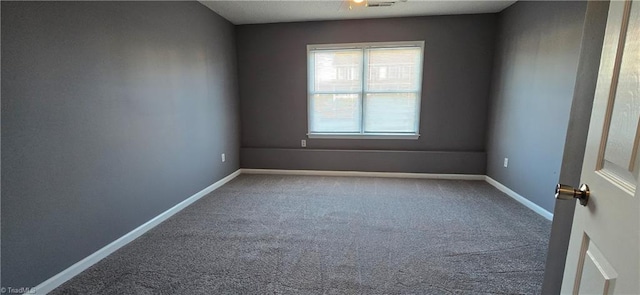 spare room featuring carpet flooring