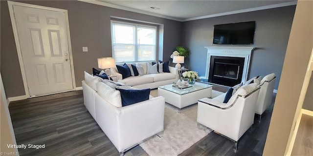 living room with wood-type flooring and crown molding