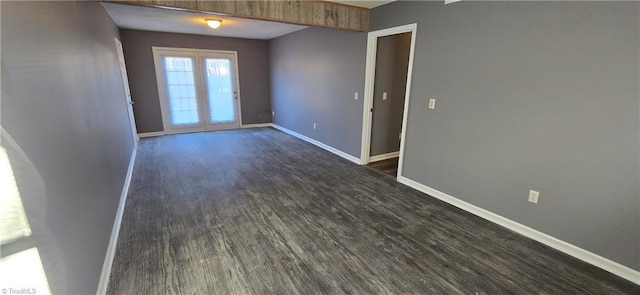 unfurnished room with french doors and dark hardwood / wood-style flooring