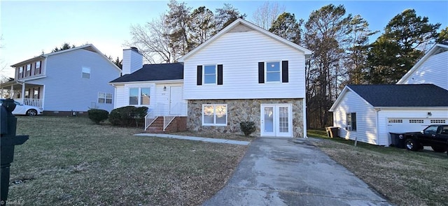 view of front facade with french doors and a front lawn