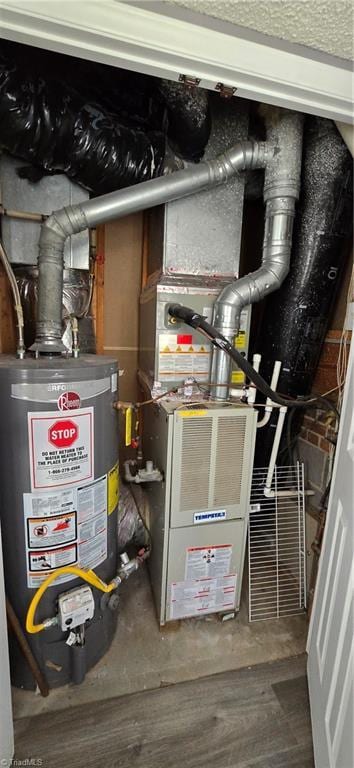 utility room featuring gas water heater