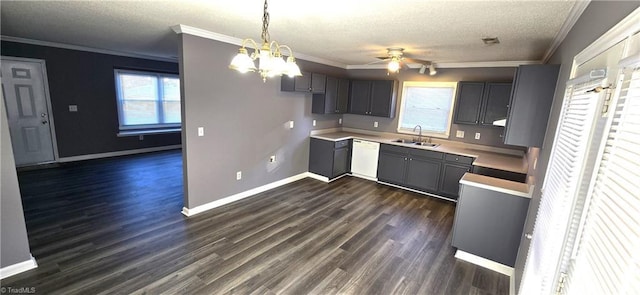 kitchen with ceiling fan with notable chandelier, a textured ceiling, white dishwasher, sink, and decorative light fixtures