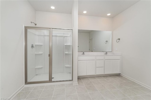 bathroom with vanity, a shower with shower door, and tile patterned flooring