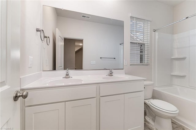 full bathroom with washtub / shower combination, vanity, and toilet