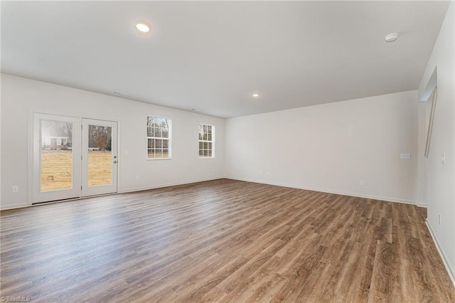 spare room featuring light hardwood / wood-style floors