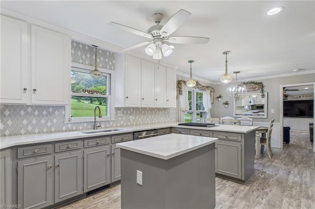 1317 Longcreek Dr, High Point, NC 27262 - kitchen with gray cabinets, a sink, a peninsula, crown molding, and light countertops
