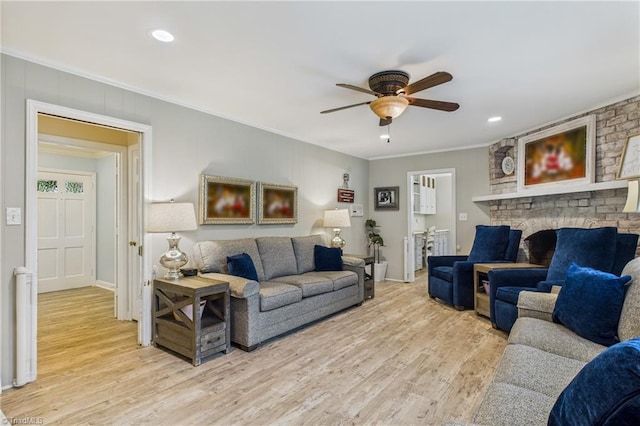 1317 Longcreek Dr, High Point, NC 27262 - living area with crown molding, ceiling fan, light wood finished floors, recessed lighting, and a brick fireplace
