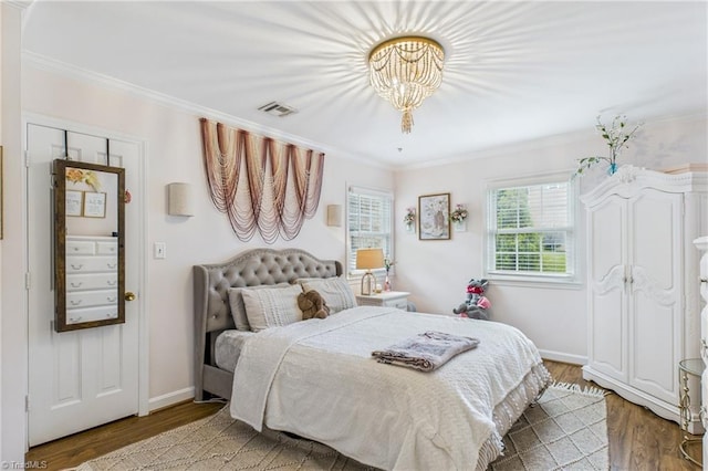 1317 Longcreek Dr, High Point, NC 27262 - bedroom featuring crown molding, wood finished floors, and baseboards