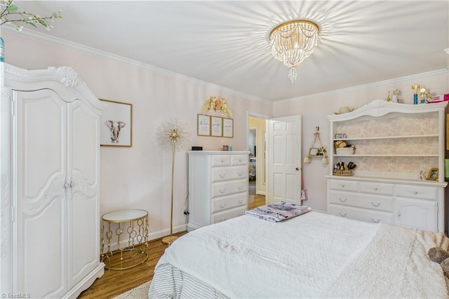 1317 Longcreek Dr, High Point, NC 27262 - bedroom with crown molding, wood finished floors, a chandelier, and baseboards