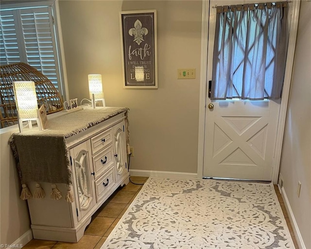 1317 Longcreek Dr, High Point, NC 27262 - doorway with light tile patterned floors and baseboards