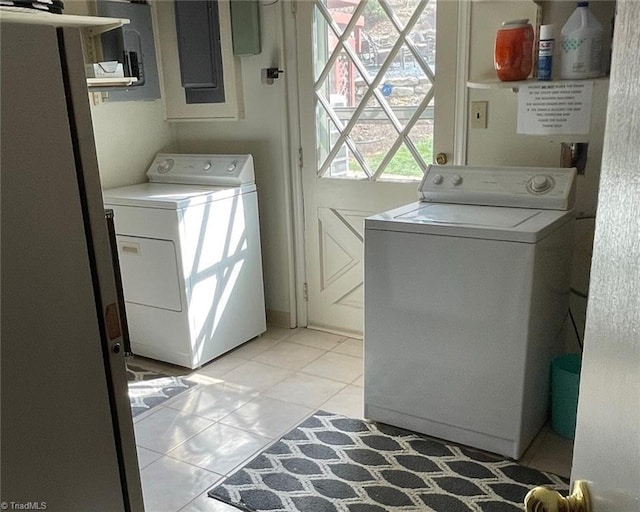 1317 Longcreek Dr, High Point, NC 27262 - laundry area featuring washer and clothes dryer, light tile patterned flooring, and electric panel