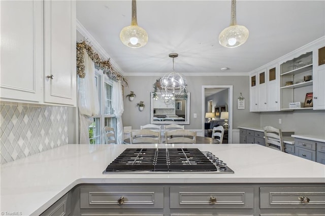 1317 Longcreek Dr, High Point, NC 27262 - kitchen with gray cabinets, stainless steel gas cooktop, light countertops, backsplash, and crown molding