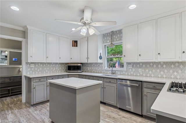 1317 Longcreek Dr, High Point, NC 27262 - kitchen with stainless steel appliances, a sink, gray cabinetry, crown molding, and recessed lighting