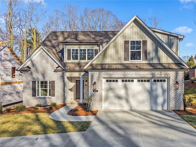 view of front of property with board and batten siding, a shingled roof, concrete driveway, and brick siding