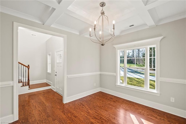 empty room with coffered ceiling, stairway, baseboards, and wood finished floors