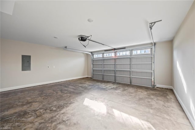 garage featuring a garage door opener, electric panel, and baseboards